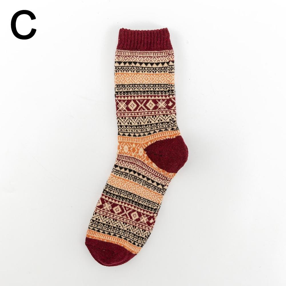 A cozy maroon and beige patterned knit men retro cotton crew sock with a ribbed cuff, toe, and heel suitable for mid-high tube fashion trend.