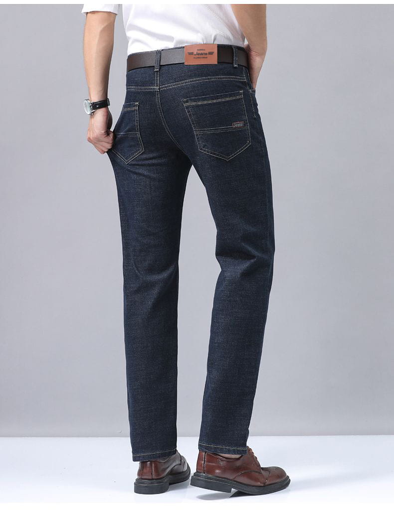 Men’s dark blue stretch cotton jeans with a classic straight-leg cut and brown leather belt buckle designed for casual wear.