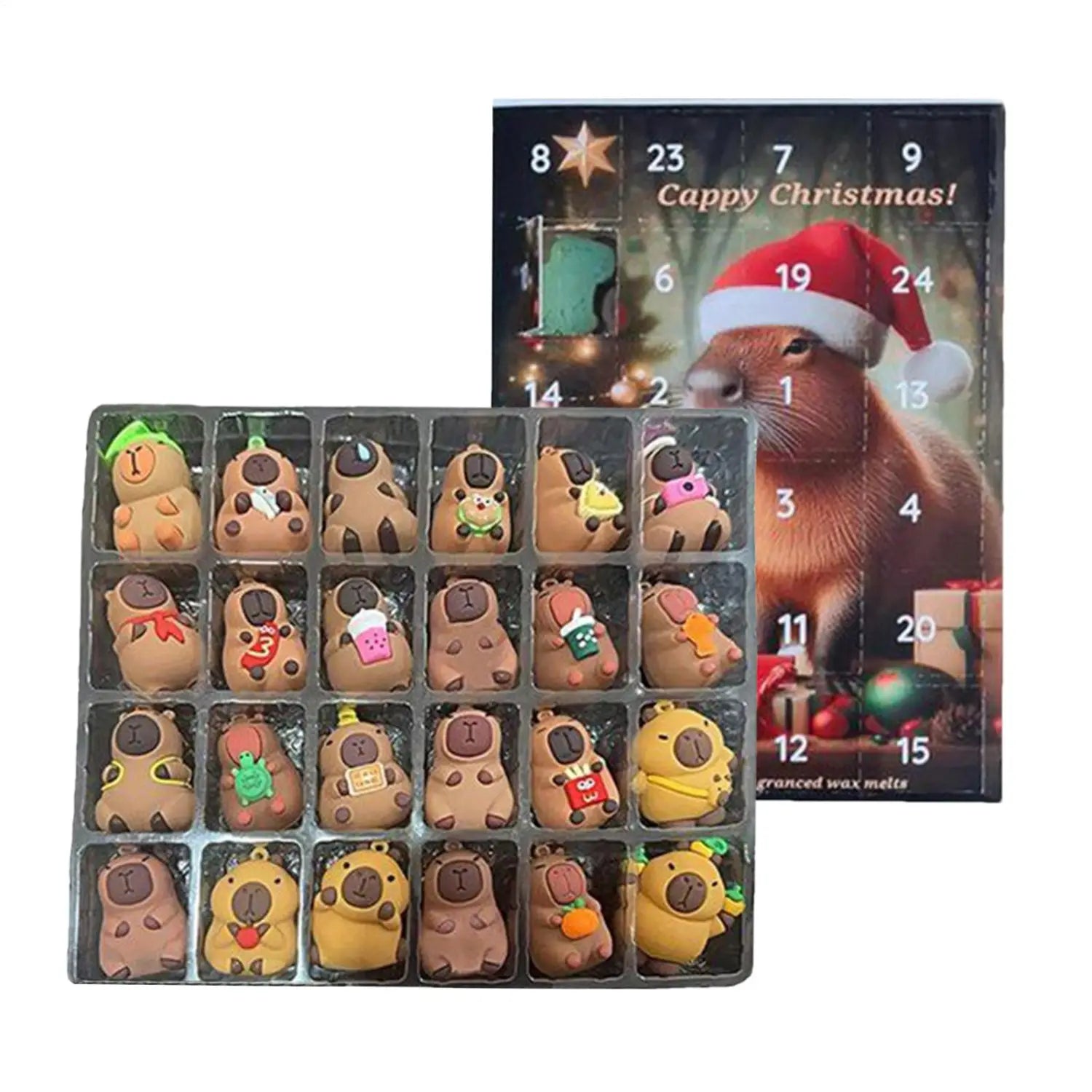 Un calendario de cuenta atrás de capibaras encantadoras que presenta 24 figuritas miniatura marrones y amarillas con accesorios festivos, cada una exhibida en una bandeja de plástico transparente.