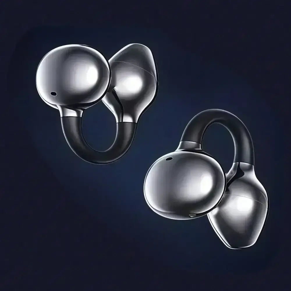 Auriculares inalámbricos de clip para oreja Bluetooth en plata y negro, con carcasas esféricas redondeadas ergonómicas y elegantes, y un estuche de carga para el control conveniente del volumen de los medios, con uso guiado mediante el manual de usuario