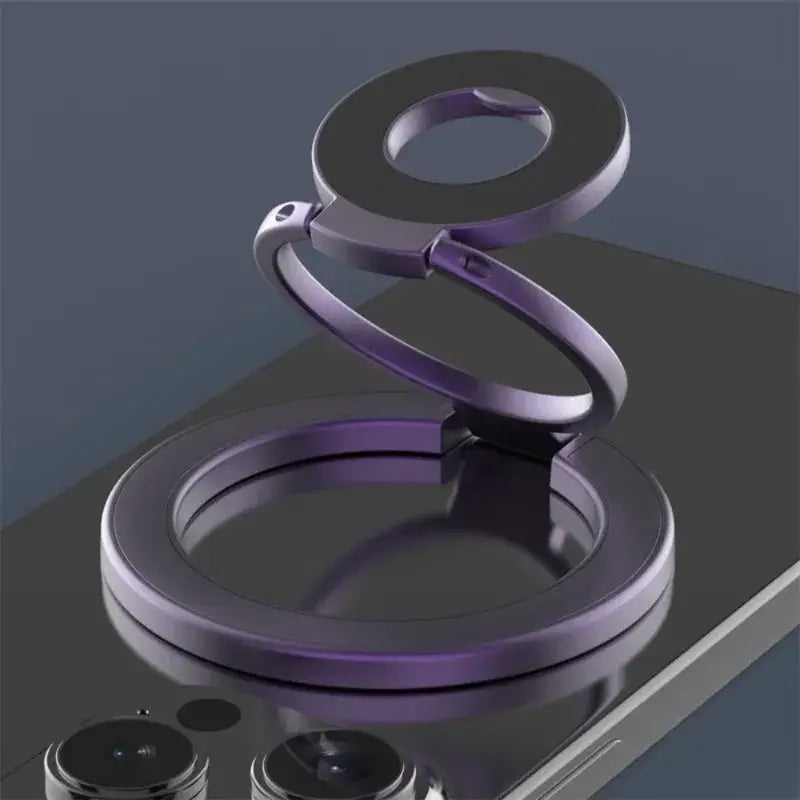 Soporte para teléfono magnético en espiral morado metálico con base circular y anillo de soporte ajustable, diseñado para uso con Magsafe.