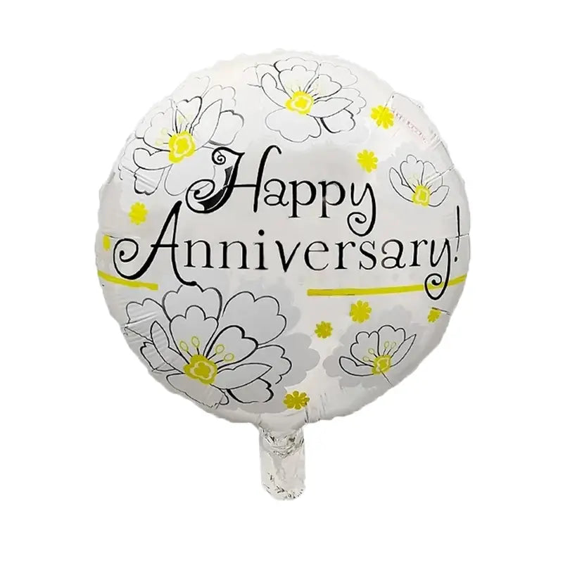 white foil balloon with black and yellow floral design and happy anniversary text included in a happy anniversary foil balloons 10 pack