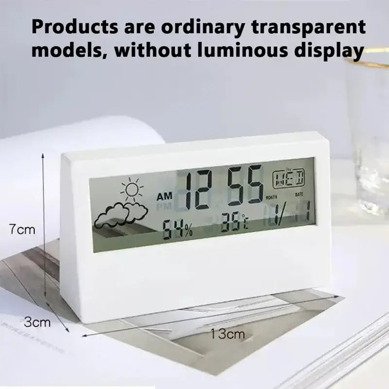 White rectangular digital weather desktop alarm clock with a transparent display showing time temperature humidity and date