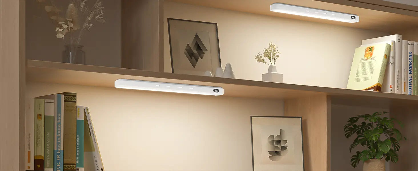 Two sleek white rechargeable motion sensor led light bars with led bulbs mounted horizontally on wooden shelves.