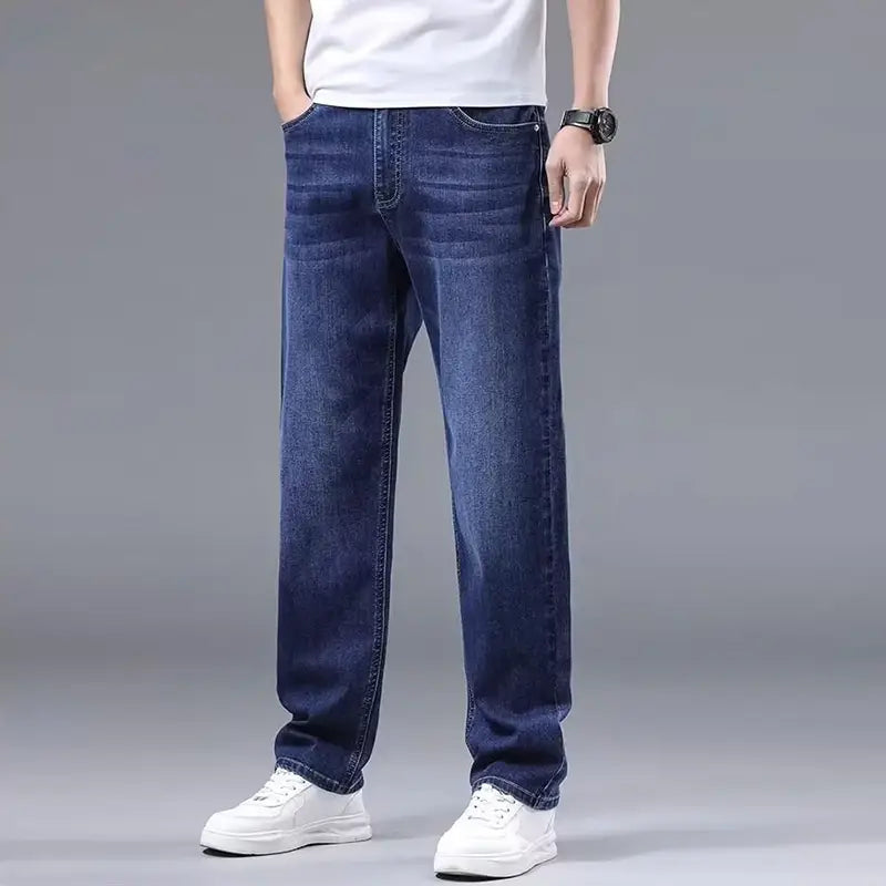 Dark blue fleece lined winter jeans for men featuring a loose straight-leg cut and classic stitching on denim material.