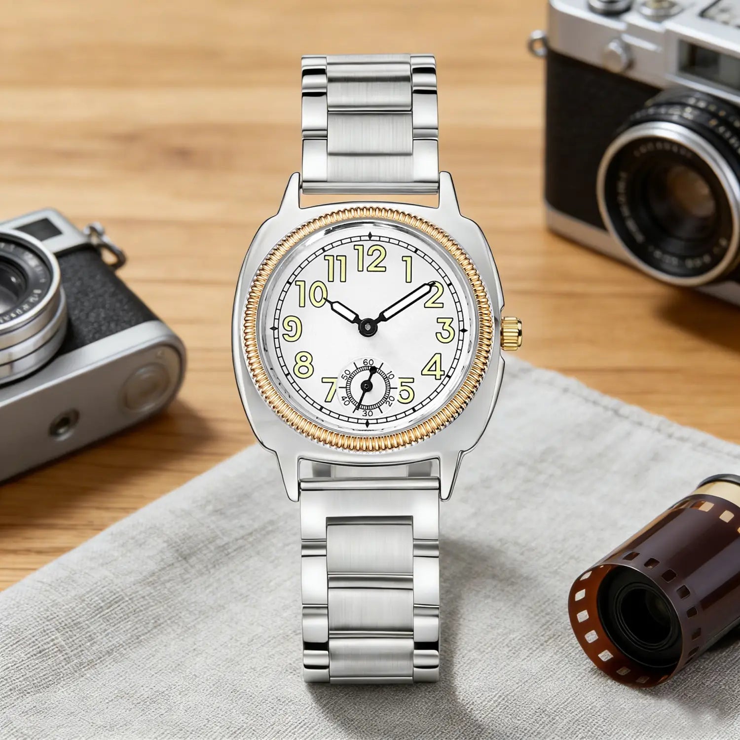 Pintime stainless steel quartz watch for women featuring a silver-toned band with a gold-tone bezel and hour markers on a white dial.