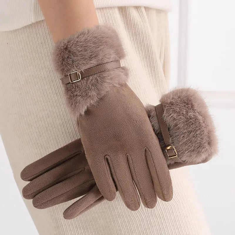 Beige women’s touchscreen winter gloves with suede-like main body, faux fur lining, and gold-tone buckle accents.