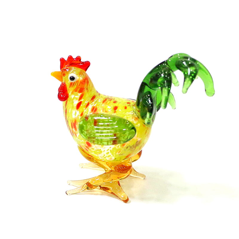 Vibrant glass rooster miniature figurine with a yellow body speckled in red, green tail feathers and comb, designed as an Easter ornament.