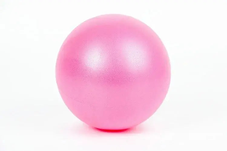 A smooth matte-finish pink exercise ball with anti-burst performance and minimal air leakage designed for balance training.