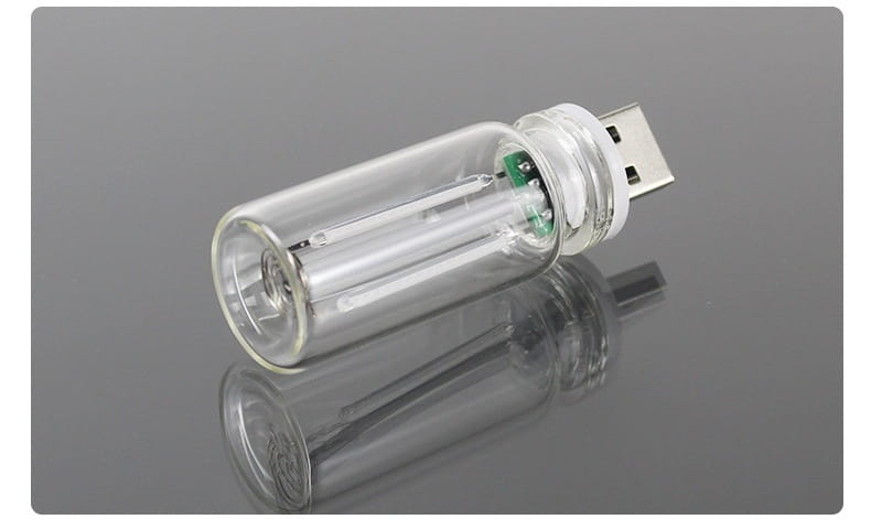 Clear glass bottle-shaped usb flash drive with a silver metallic connector designed as a usb night light and color changing atmosphere light.