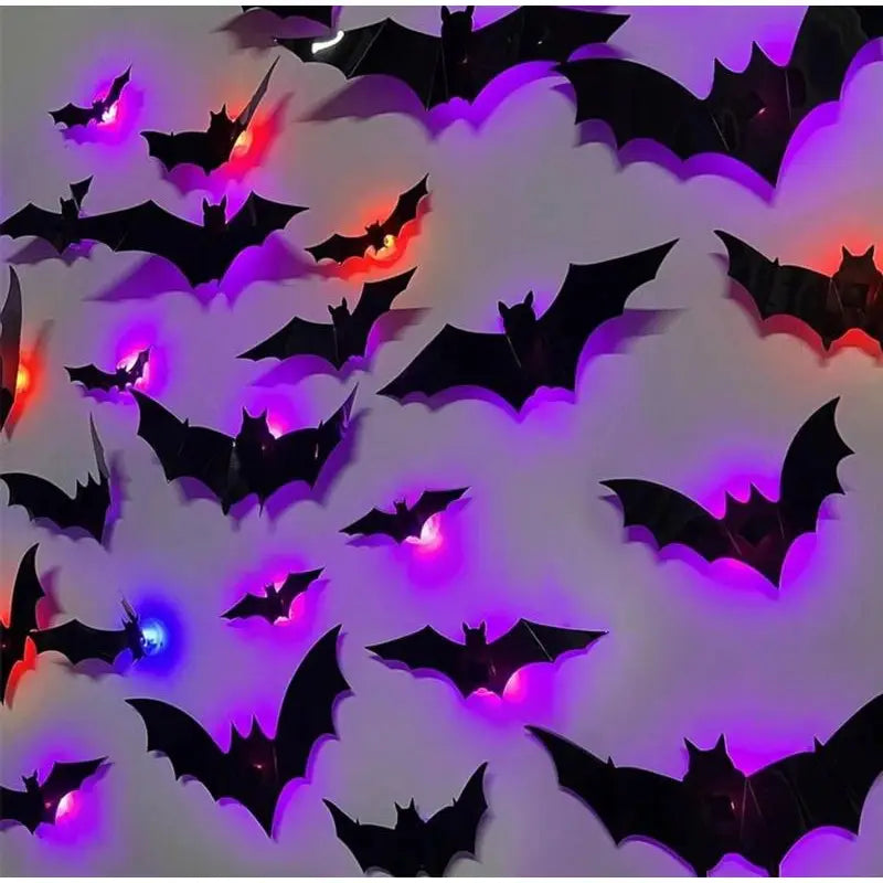 lámpara de noche LED estereoscópica con forma de murciélago, fabricada con material PET, con murciélagos de papel negro iluminados con luces LED moradas, naranjas y azules en estado luminoso.