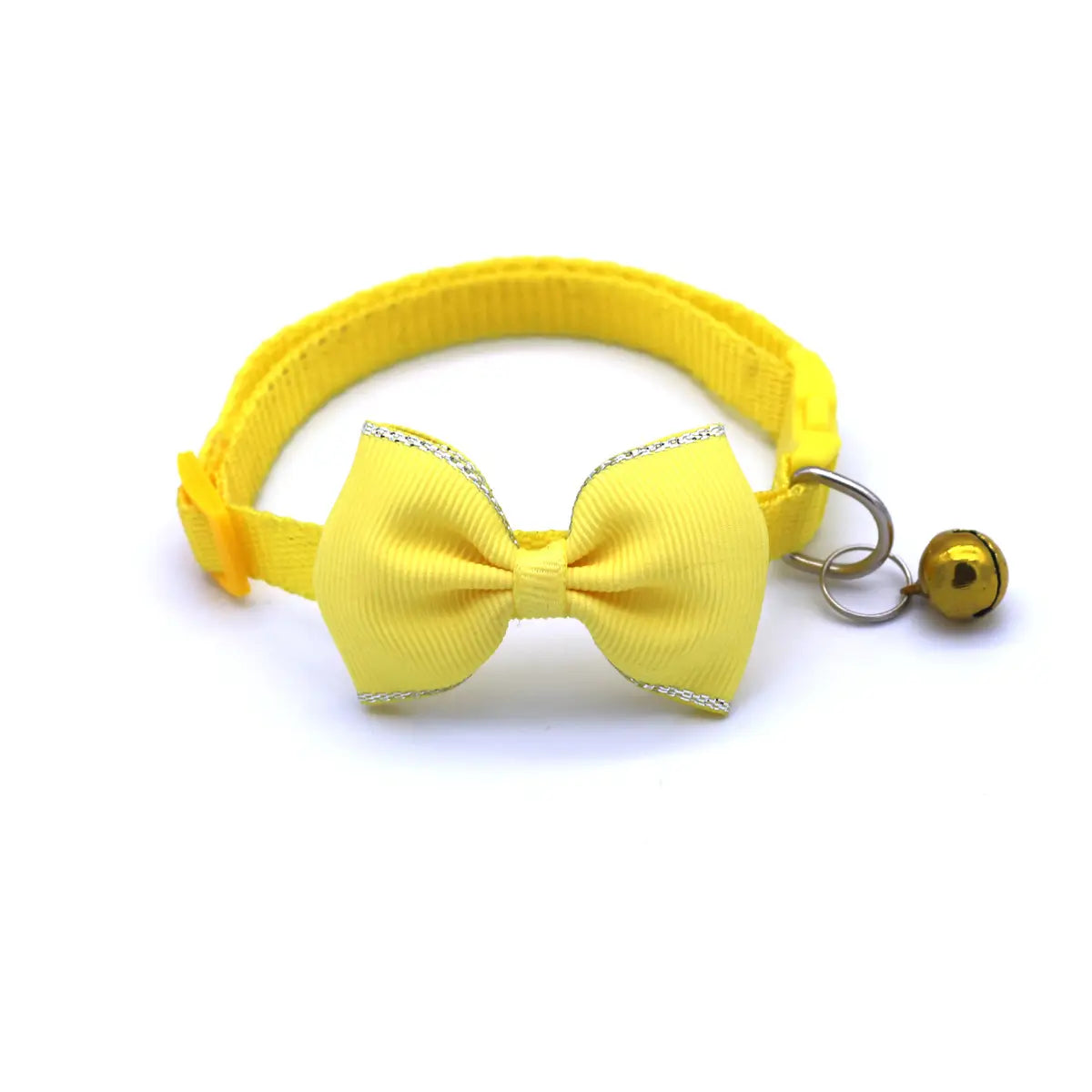 Bright yellow adjustable cat collar bowtie set with silver glitter trim and a small gold bell.