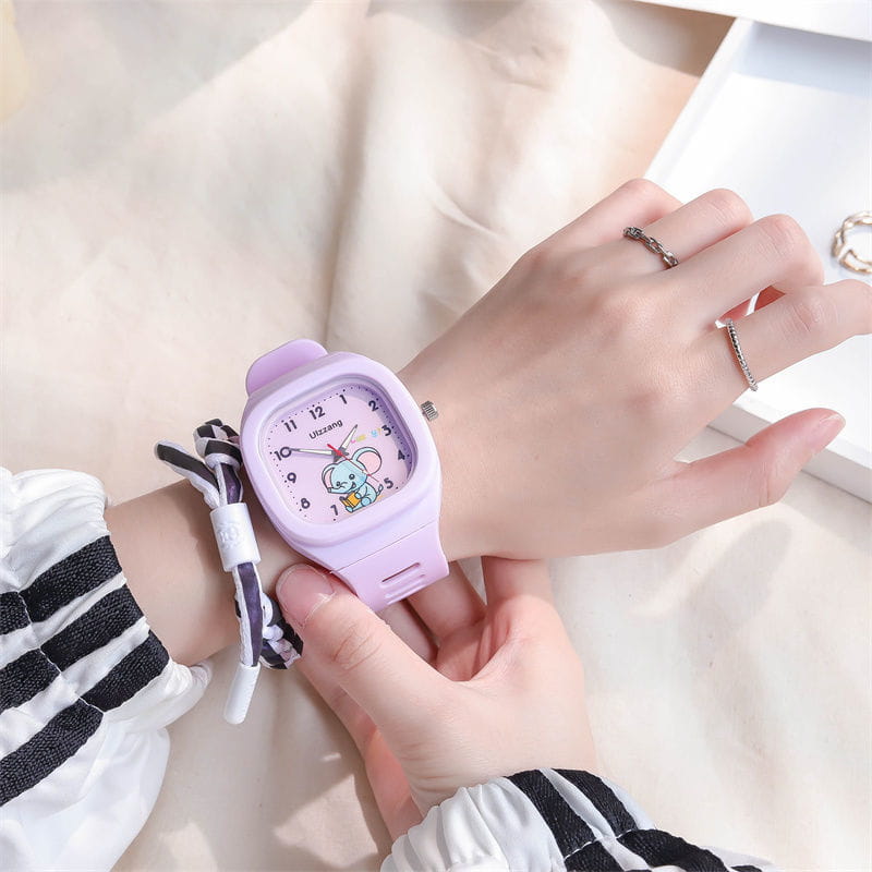 pastel purple rectangular kids luminous cartoon elephant digital watch featuring a cute cartoon character on the face designed for children.