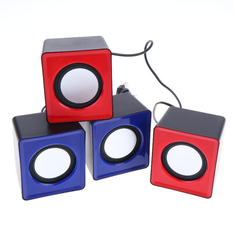 Set of three cube-shaped usb desktop speakers in red and blue with black accents for stereo audio computer system.