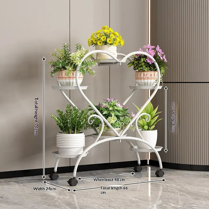 Blumenständer aus weißem Metall in Herzform mit vier Ebenen und Rollrädern zur Präsentation von Blumentöpfen