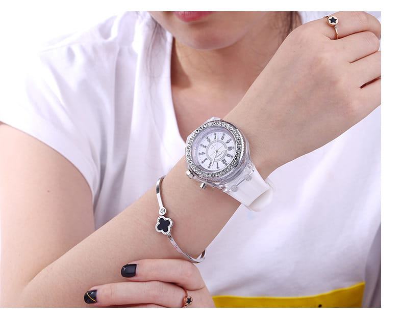A white led luminous silicone watch with a sparkling diamond-encrusted bezel and clear silicone strap.