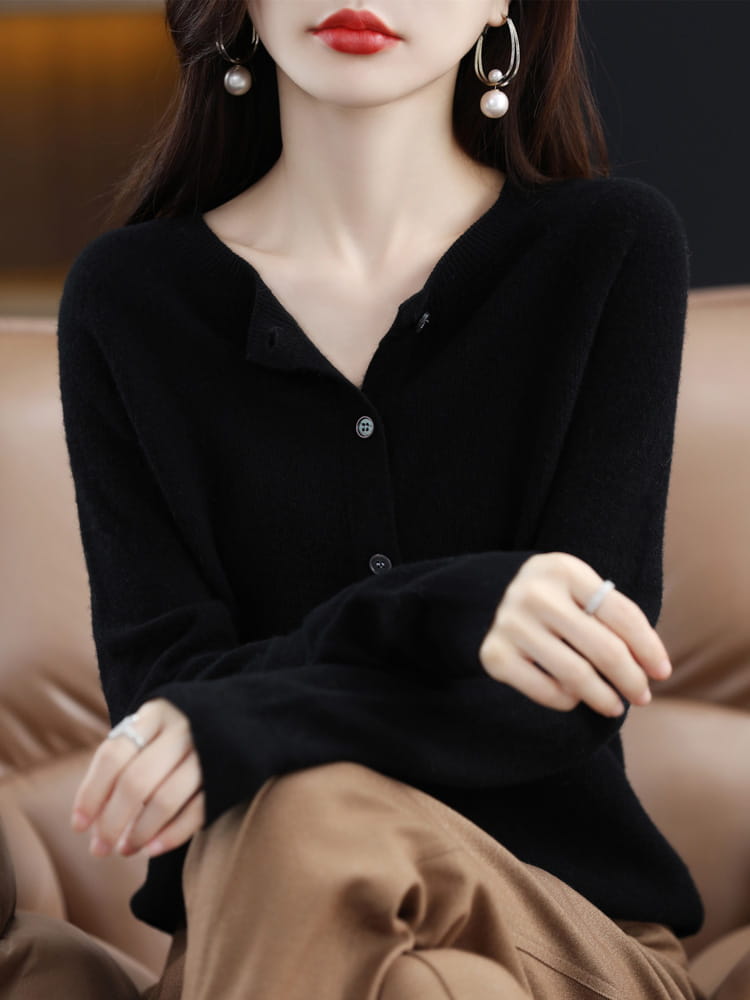Black long-sleeved merino wool cardigan for women with a v-neck and button closure suitable as a cashmere knit sweater.
