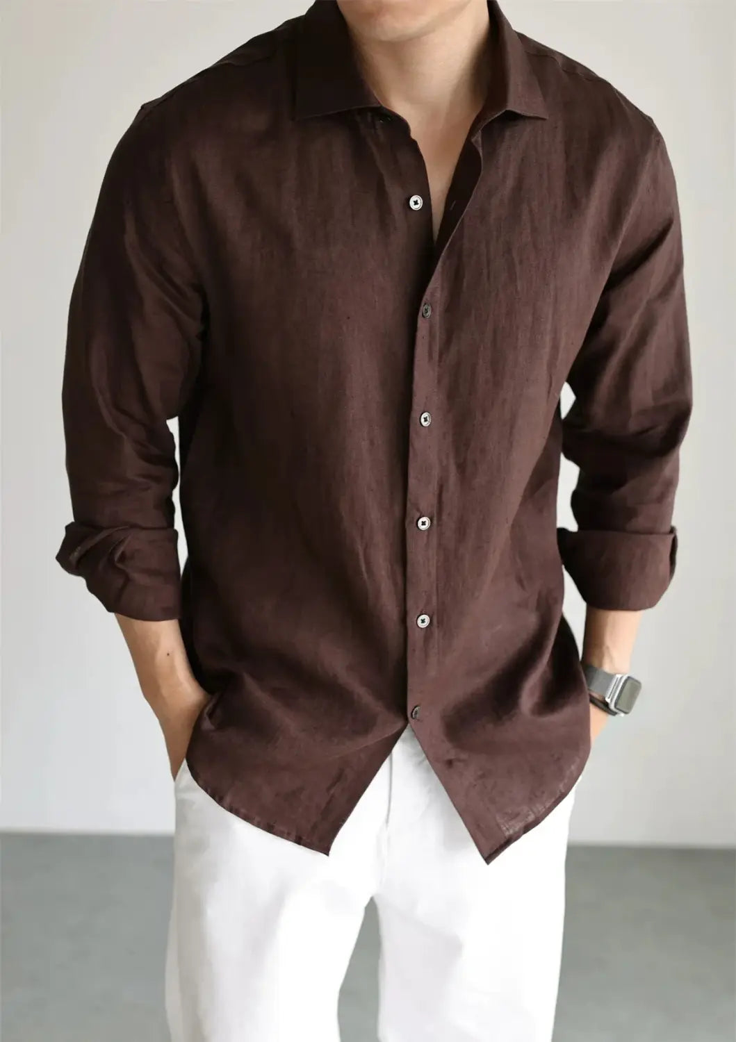 Men cotton linen casual button down shirt in dark brown with long sleeves, rolled cuffs, and a classic collar.