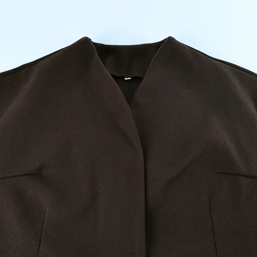 Wool belted coat brown winter jacket in dark brown matte fabric with structured collar and subtle stitching details.