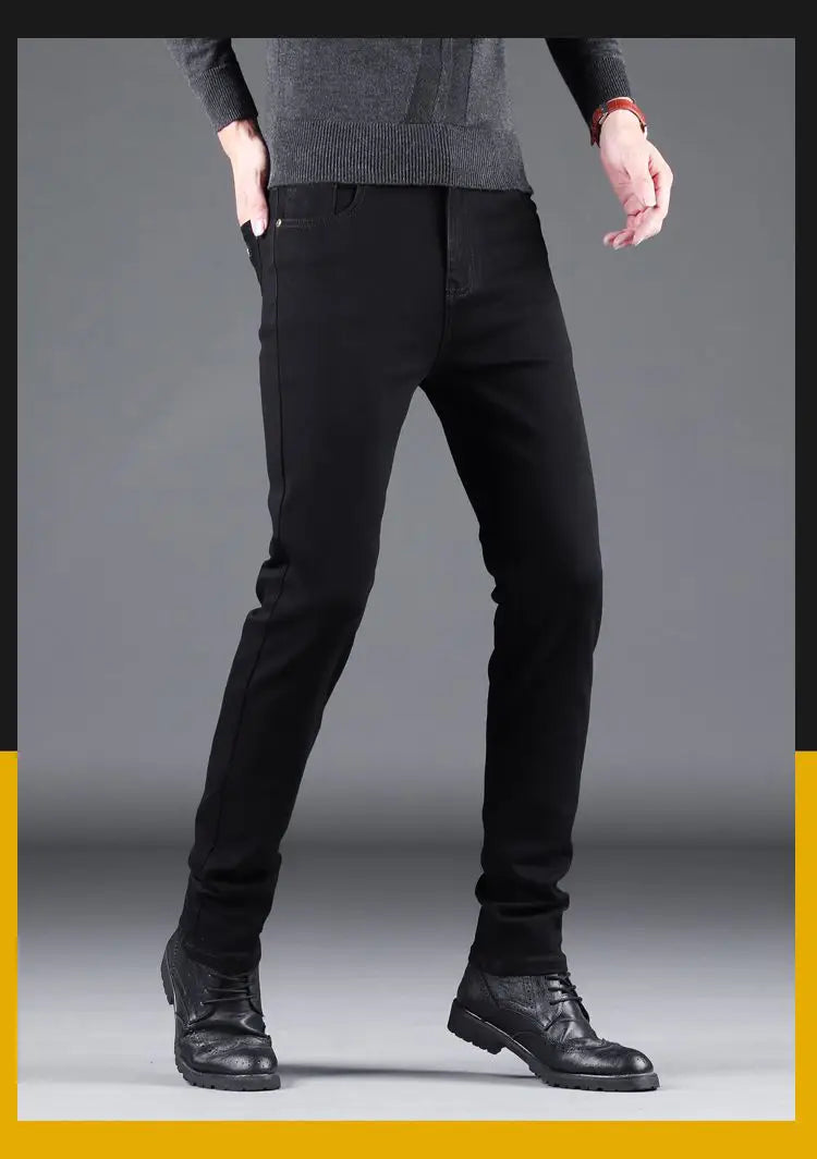 Men black slim fit stretch denim jeans with a classic five-pocket design and subtle stitching details.