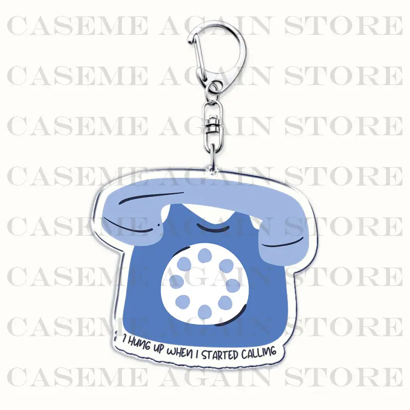 Blue acrylic phone-shaped keychain by Gracie Abrams with a silver metal clasp and the phrase i hung up when i started calling printed along its bottom edge, an anime fan gift.