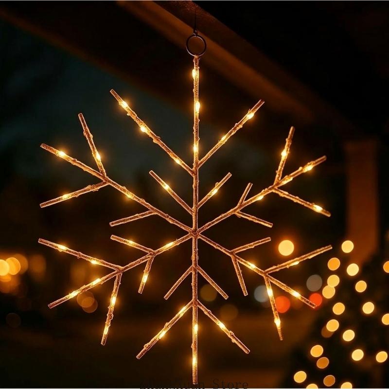 A warm glowing led gold snowflake Christmas tree and wreath ornament with a rustic twig-like design and frosted finish.