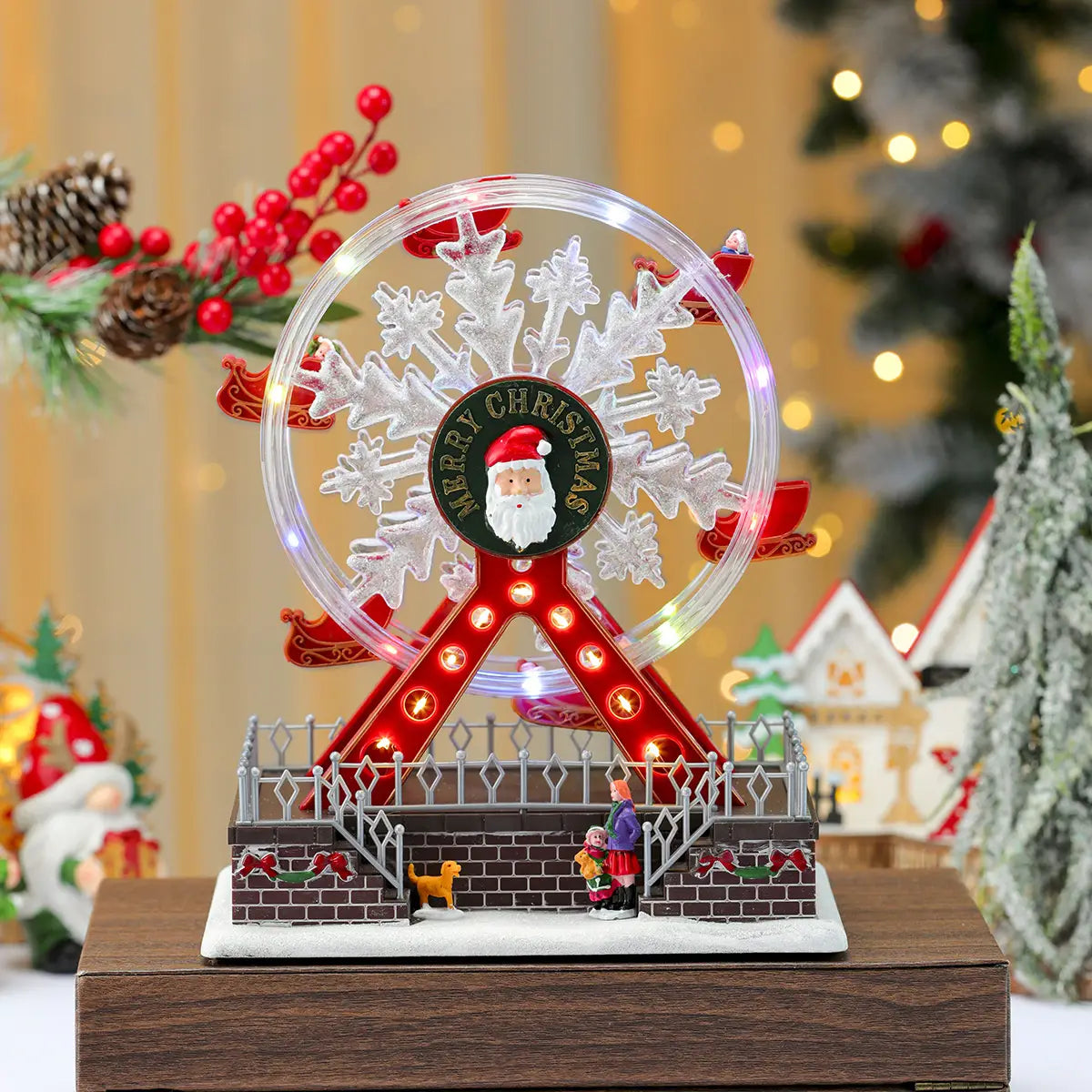 Ornement de manège forain musical de Noël présentant un cadre en acrylique transparent avec des éléments décoratifs rouges et blancs et un médaillon central de père Noël, illuminé de manière festive