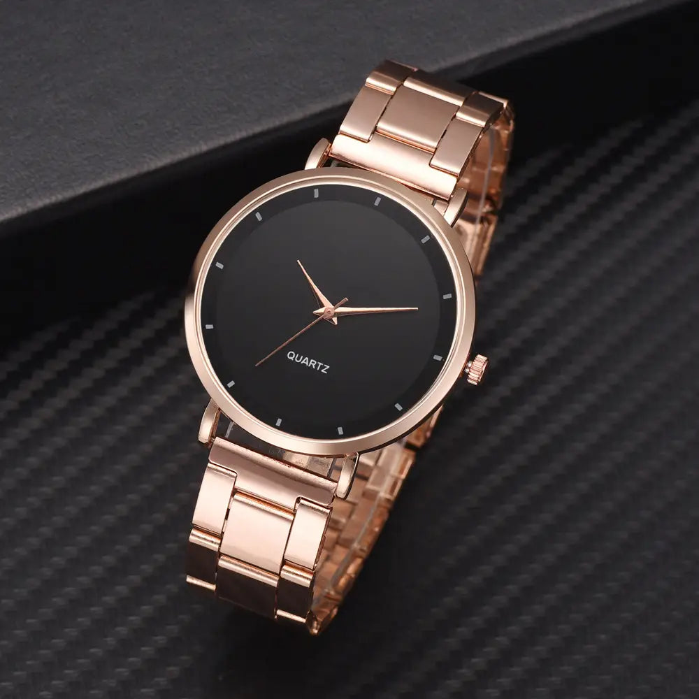 Rose gold women luxury watch quartz business wristwatch made of stainless steel with a sleek black dial and minimalist white hour markers.