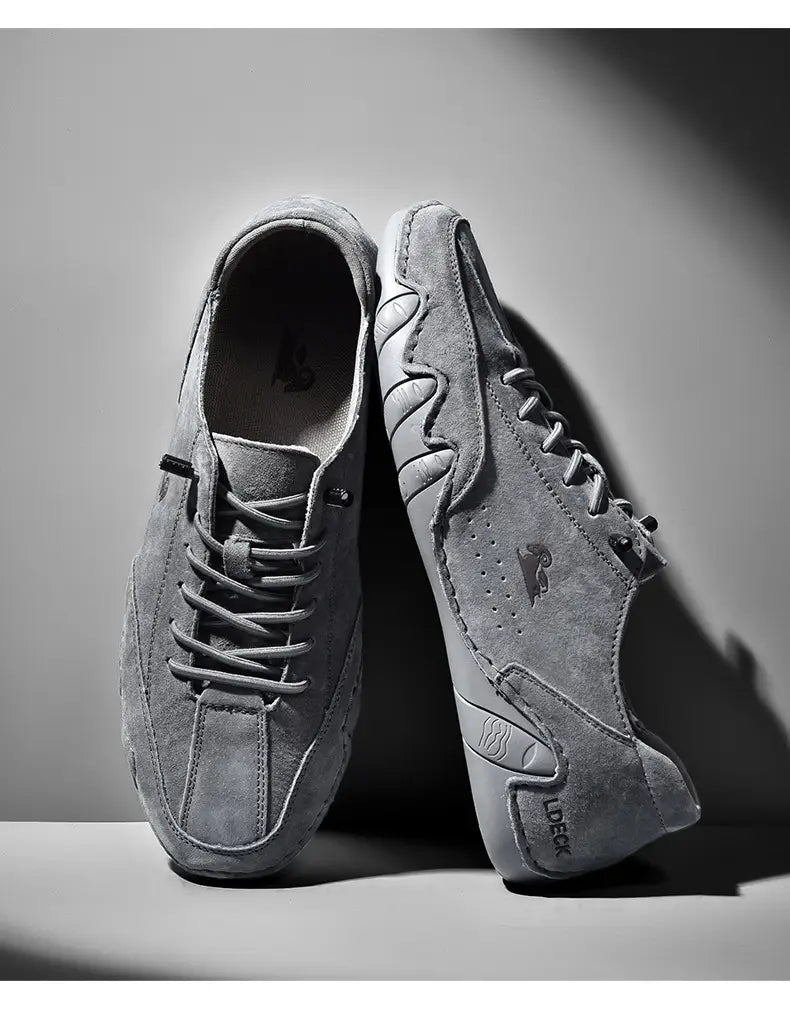 Men high top leather casual sneakers in gray suede featuring a sleek modern design and subtle branding details.