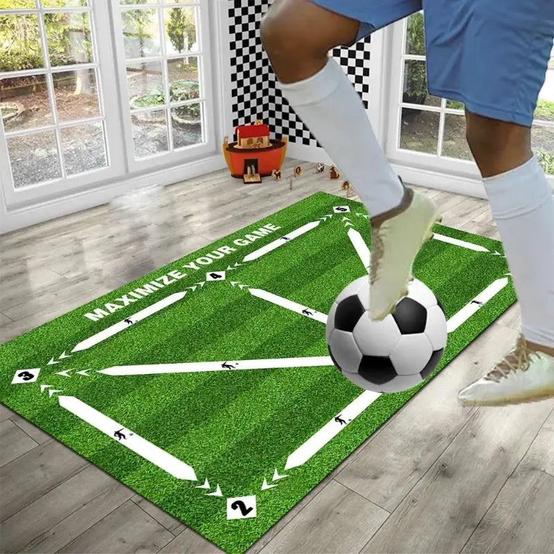 Soccer training mat non slip dribble practice equipment in green color featuring white directional arrows numbered zones and a printed black and white soccer ball at the center.