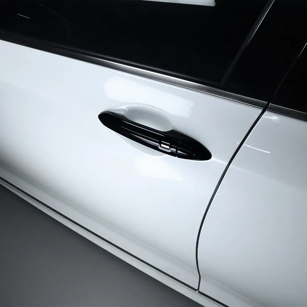 Garniture de protection de poignée de porte en ABS noir brillant pour porte de véhicule Genesis G80 blanche.