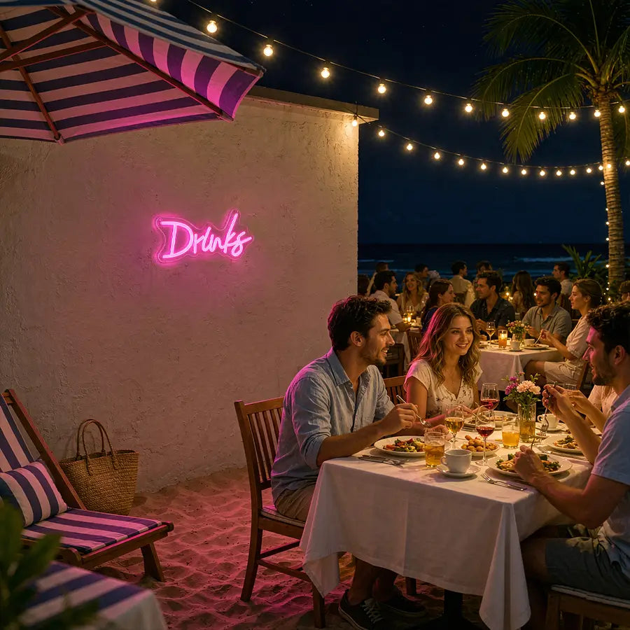enseigne au néon rose en police cursive indiquant « drinks », réalisée en LED pour décoration murale
