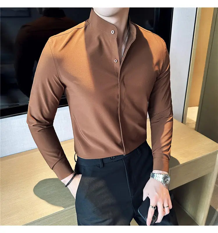 A sleek brown long-sleeved slim fit dress shirt with a stand collar and subtle sheen designed to ensure the correct size for formal occasions.