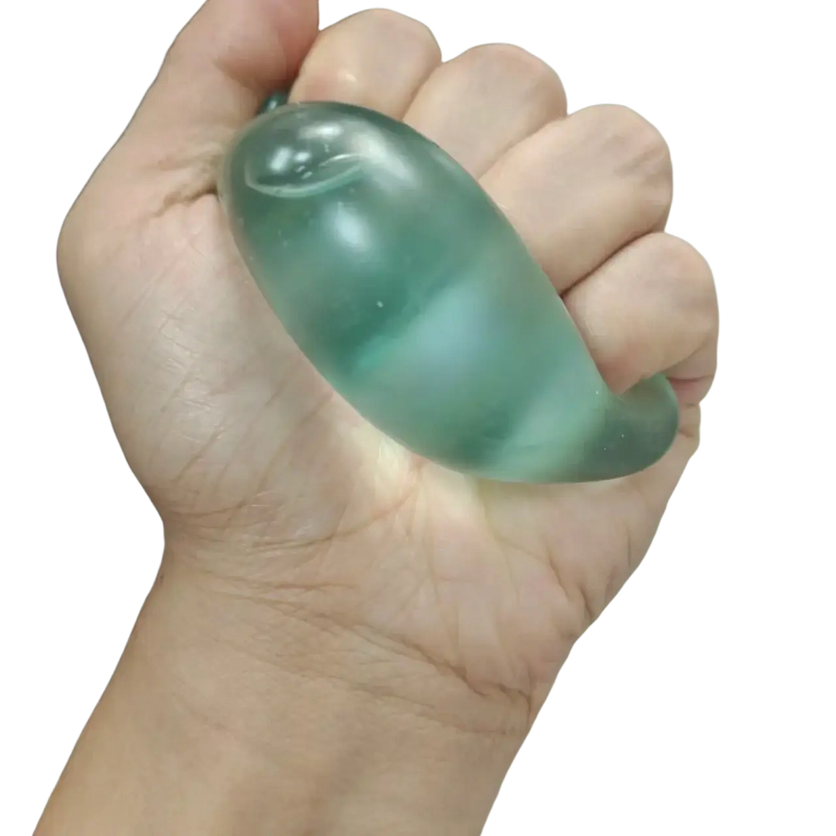 A translucent green jadeite figurine shaped like a stylized fish held in hand as a sensory fidget toy