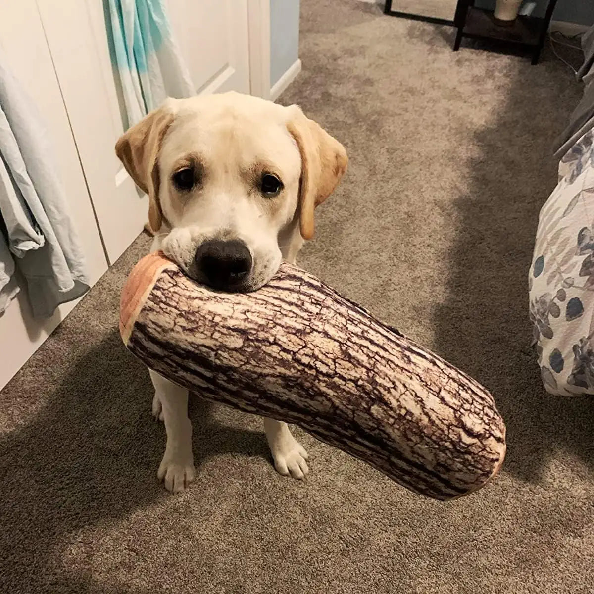 a plush log throw pillow shaped like a cylinder cushion with a realistic brown and beige wood grain texture designed as a dog toy