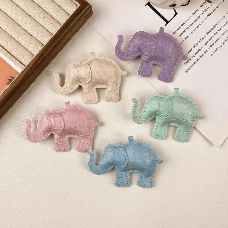 Pastel-colored pu leather elephant keychains with crocodile skin texture and stitched details designed as diy animal charms.