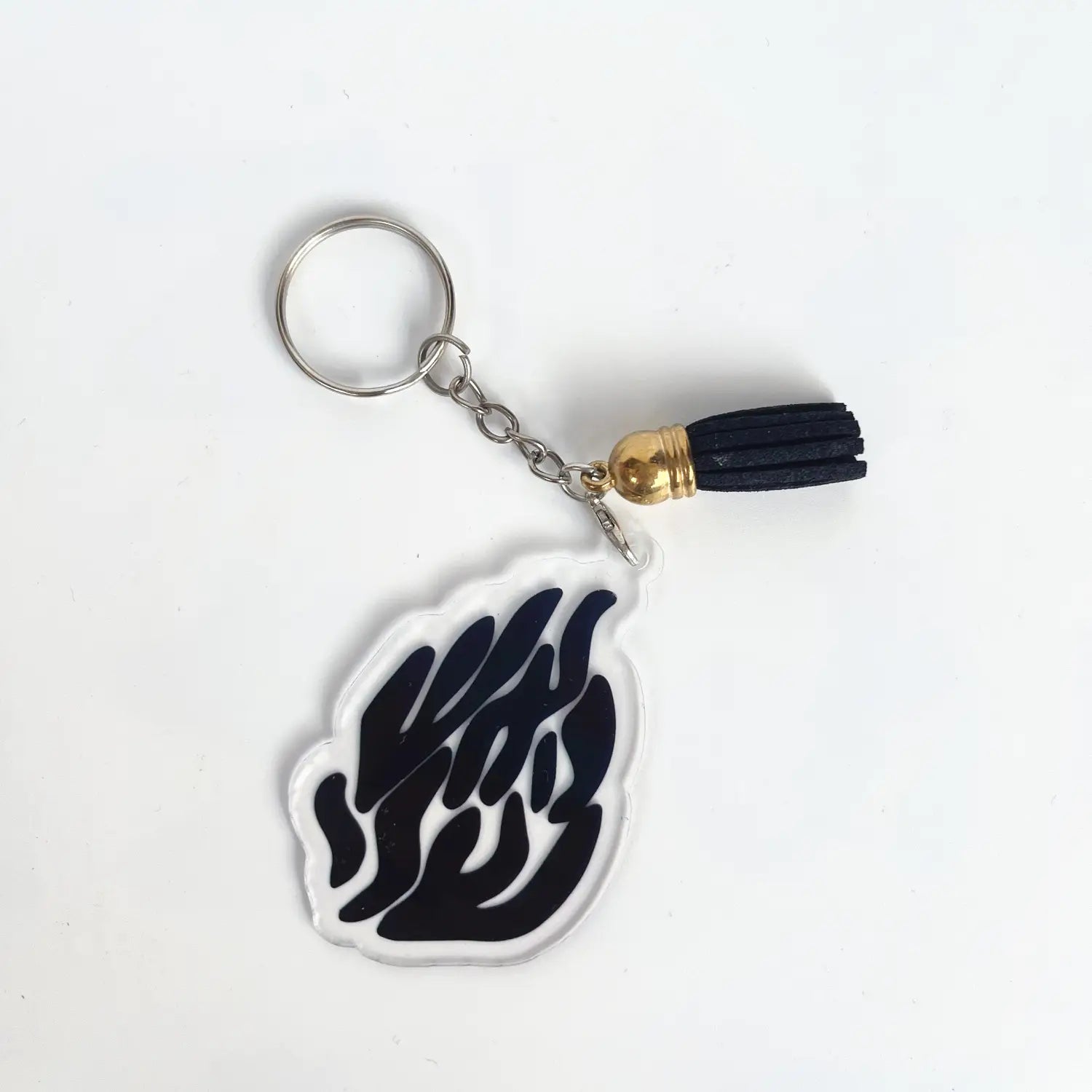 Clear acrylic keychain featuring a black stylized flame design with a gold-toned tassel included in a Jewish blessing card acrylic keychain party favor set of 10 pieces.