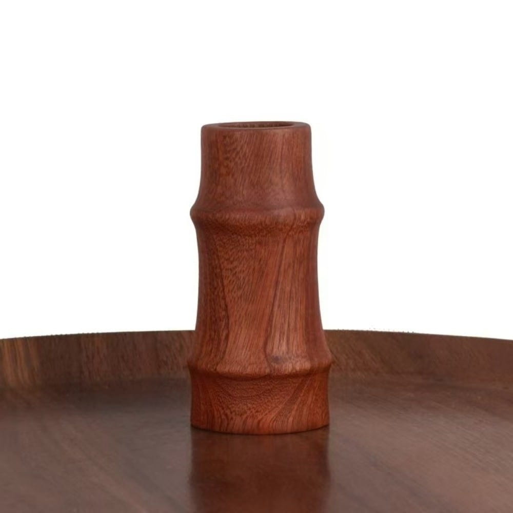 A smooth reddish-brown wooden flower vase with a bamboo-inspired design for minimalist tabletop decor.