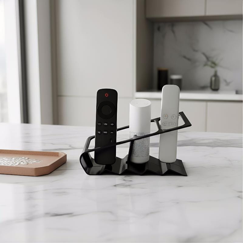 black metal remote control organizer desktop storage rack designed for holding remotes and speakers.