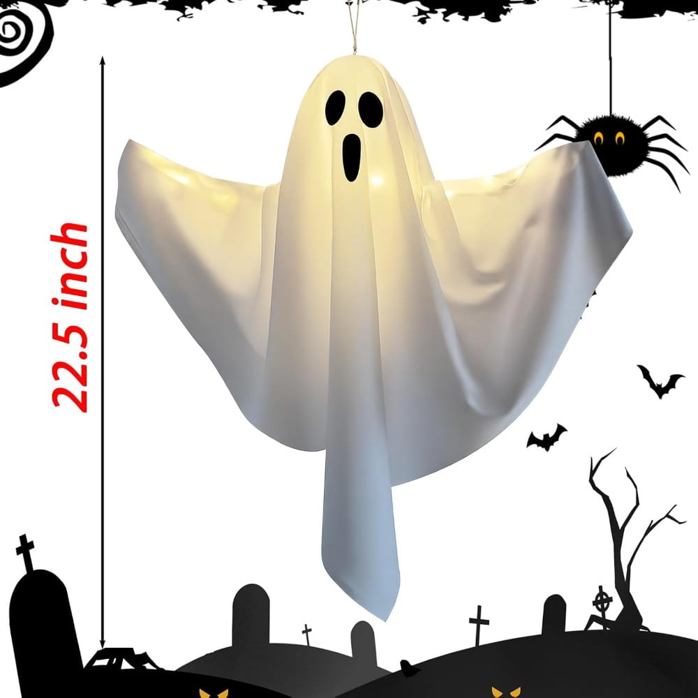 a glowing white inflatable halloween ghost with black eye and mouth cutouts hanging from a string used as ghost pathway lights for outdoor halloween ghost decoration