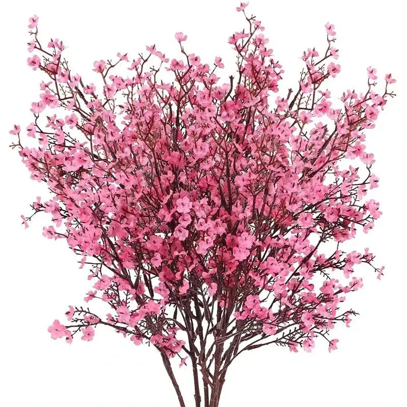 A vibrant pink artificial flowers cherry blossoms bouquet with delicate densely packed flowers and dark brown branches.