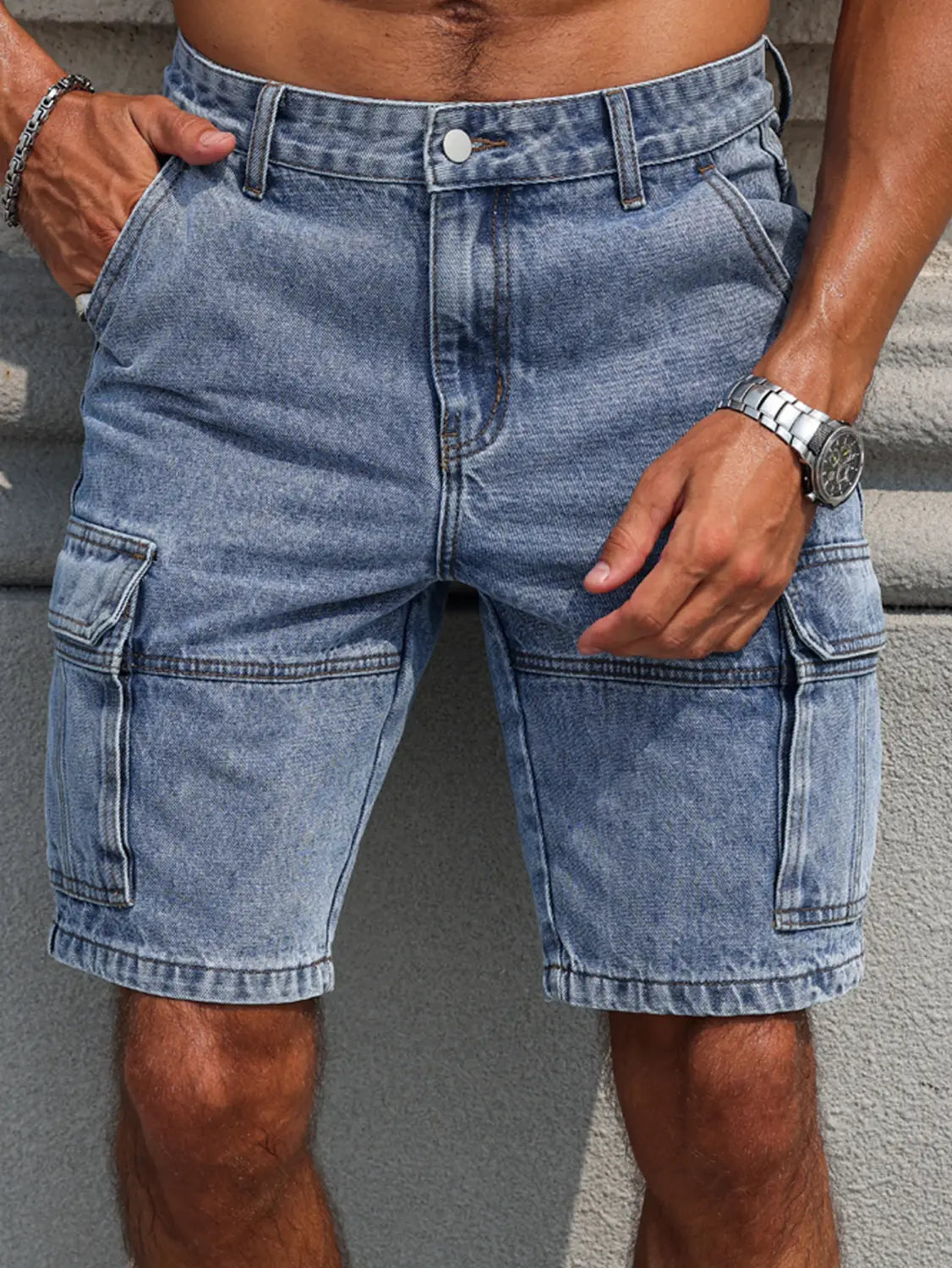 Men blue denim cargo shorts in light-wash denim with multiple pockets and a classic button closure in a regular fit.