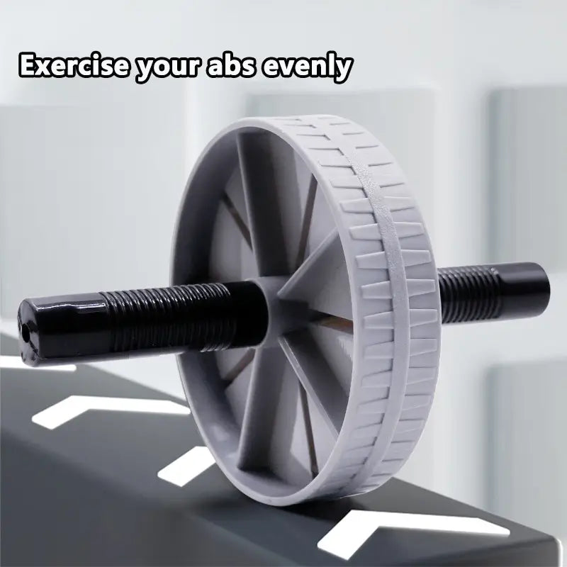 Roue d’exercice abdominale silencieuse « ab roller » gris et noire, avec préhension texturée sur la roue, pour une stabilité d’entraînement améliorée.