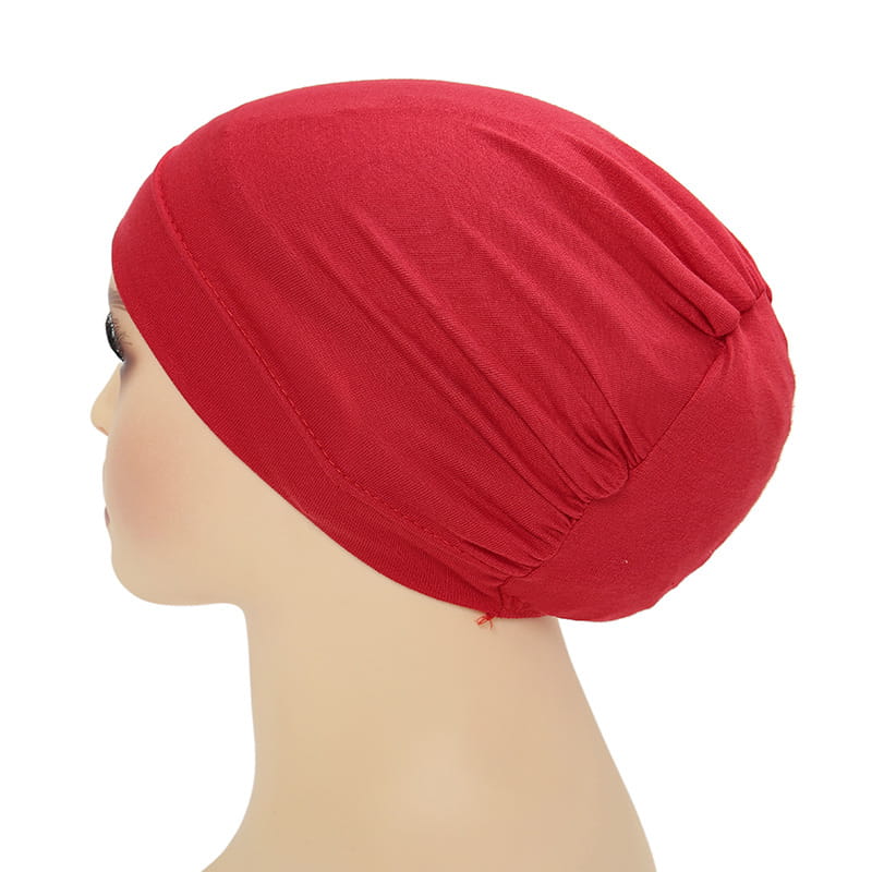 Red stretchy jersey fabric headwrap with a gathered slouchy design in a hijab cap and turban set.