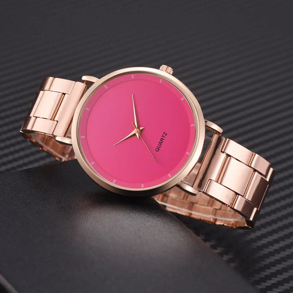Rose gold women luxury quartz wristwatch with a vibrant pink dial and minimalist rose gold-tone stainless steel design for business use.