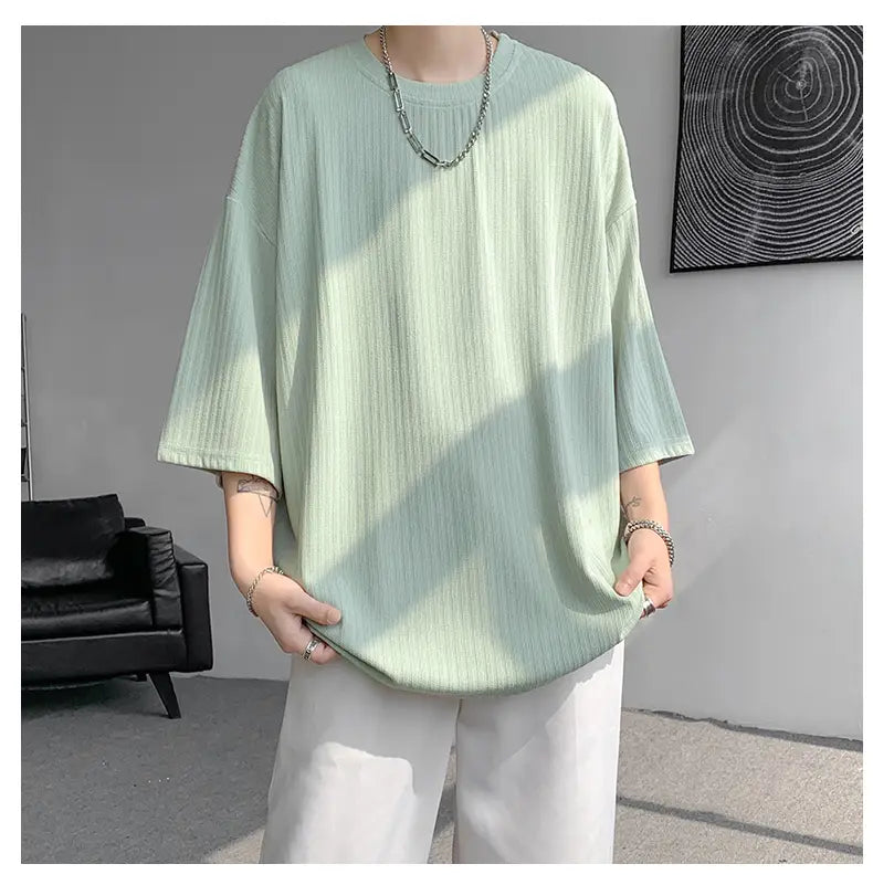 Men striped oversized summer t-shirt in light green ribbed cotton with a relaxed fit and three-quarter sleeves.