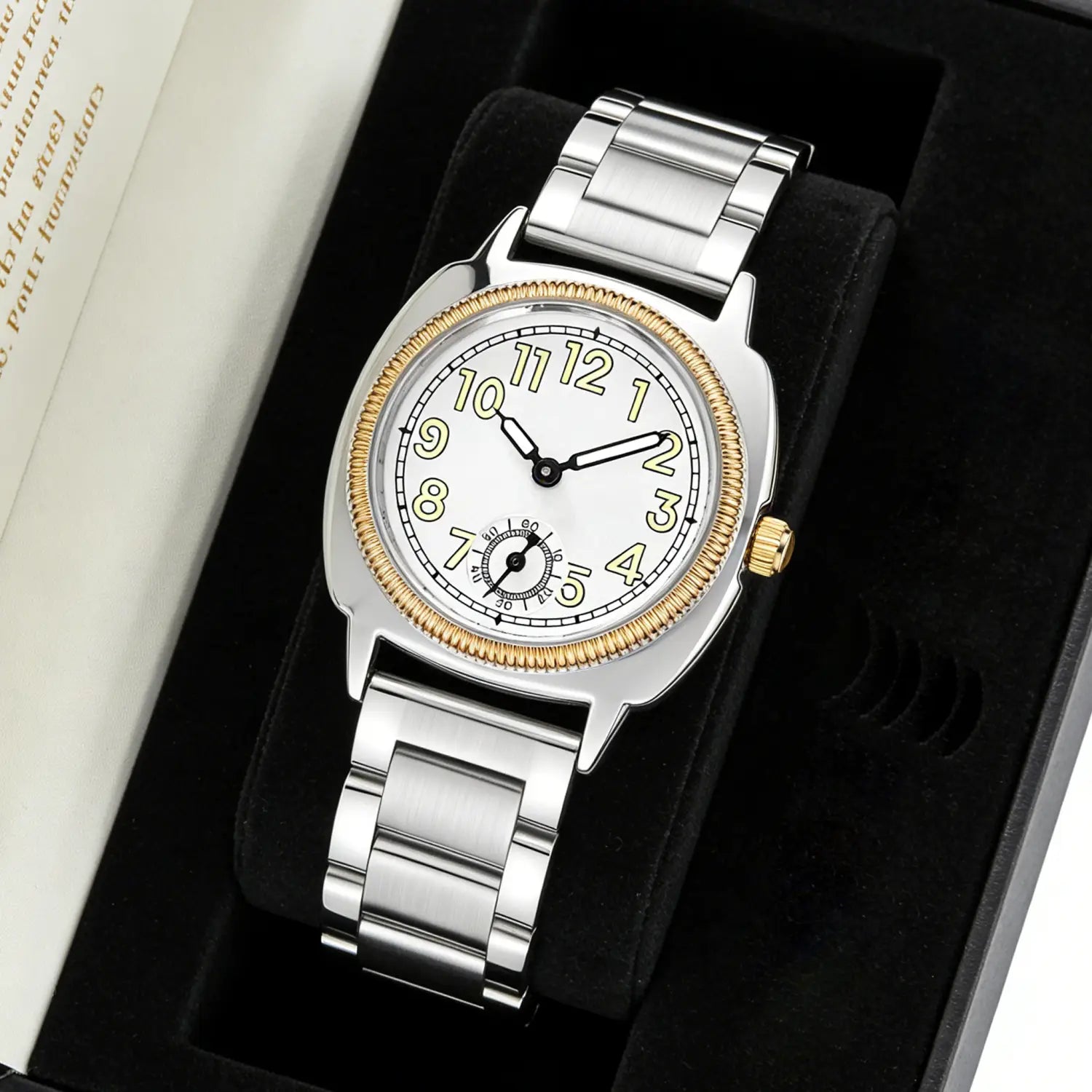 A sleek Pintime stainless steel quartz watch for women featuring silver and gold tones with a white dial black hands and luminous yellow numerals.