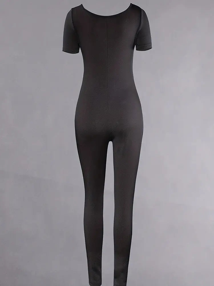Mono jumpsuit negro tipo bodycon de manga corta para mujer con diseño ceñido, escote redondo y construcción sin costuras.