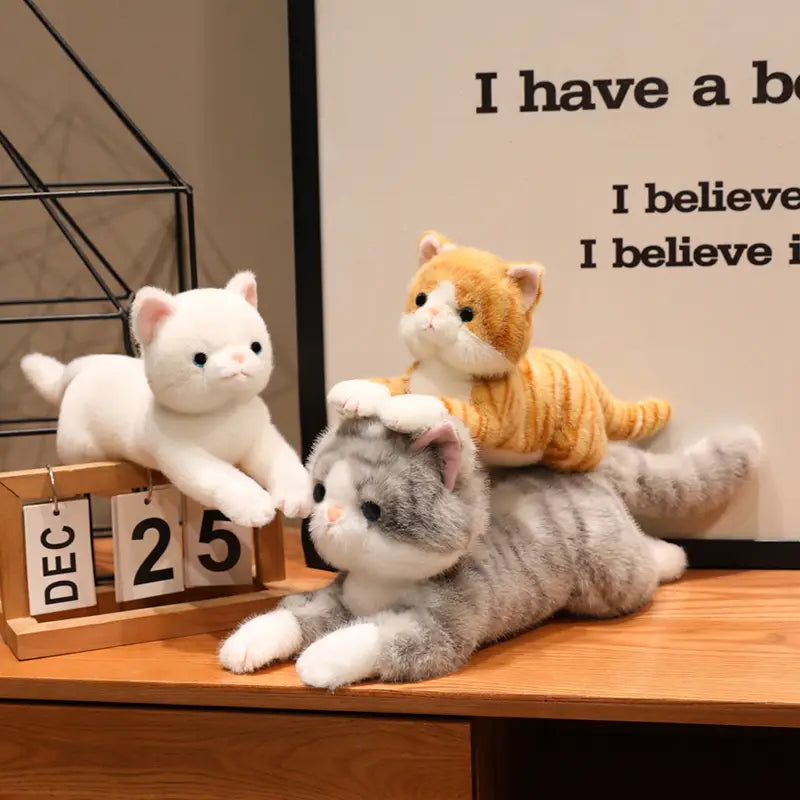 three plush toys soft cute kitten stuffed animals pillow featuring a white cat, an orange tabby with stripes, and a gray tabby with black markings