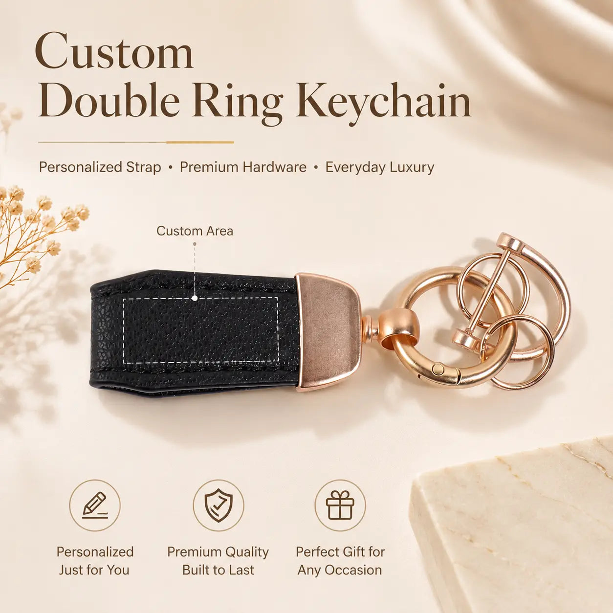 Black leather personalized keychain with rose gold metal rings and customizable engraved strap area for key holding